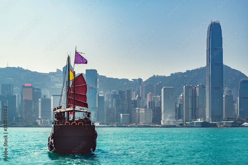 Naklejka premium Retro small ship in Hong Kong harbour.