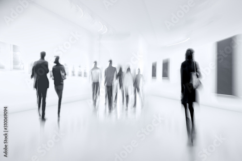 people in the art gallery center in monochrome blue tonality