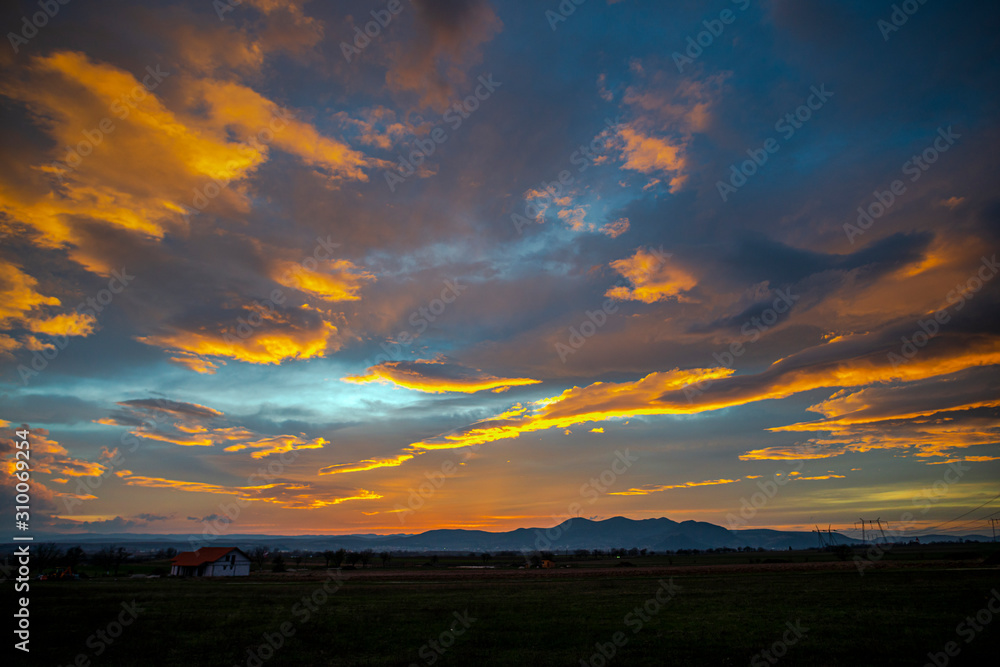 Fototapeta premium Fantastic clouds at the sunset