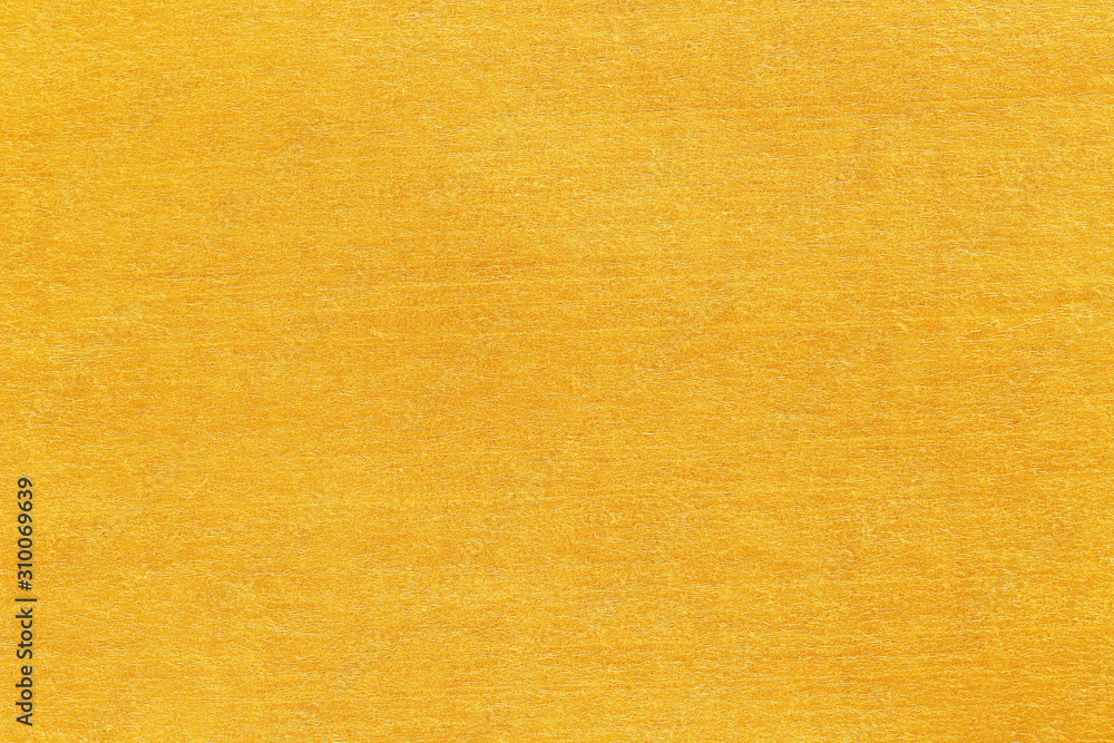 Naklejka premium Shiny yellow leaf gold foil texture background