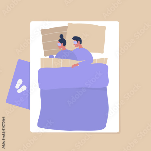 Top view of a young adult couple cuddling under the blanket in the bedroom, modern interior and lifestyle