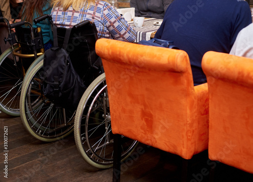 Obraz na plátne unrecognizable man in wheelchair in cafe
