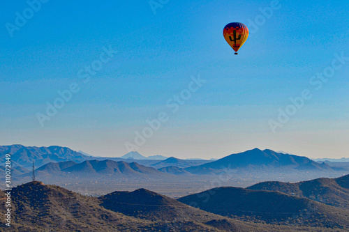 Hot Air Balloon floating over the Misty Mountains of the Arizona Desert near Phoenix © Mary Baratto
