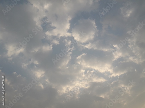 blue sky with white fluffy clouds for background 