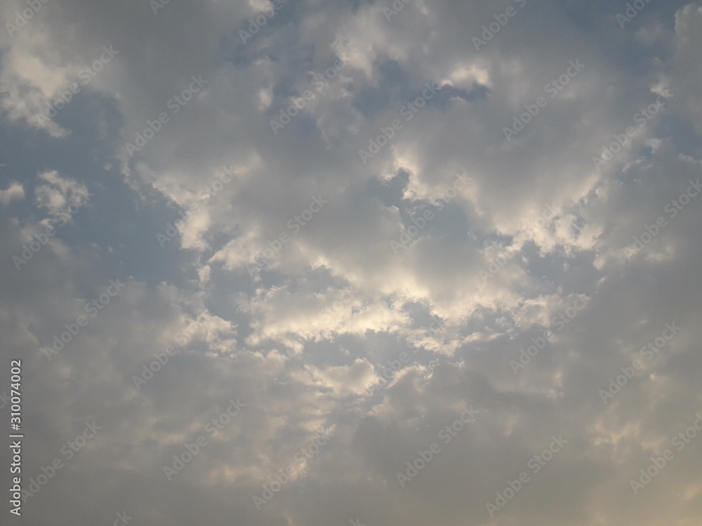 Dramatic blue sky with white puffy clouds for background 