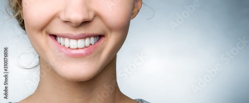 Beautiful smile of young woman with healthy white teeth photo