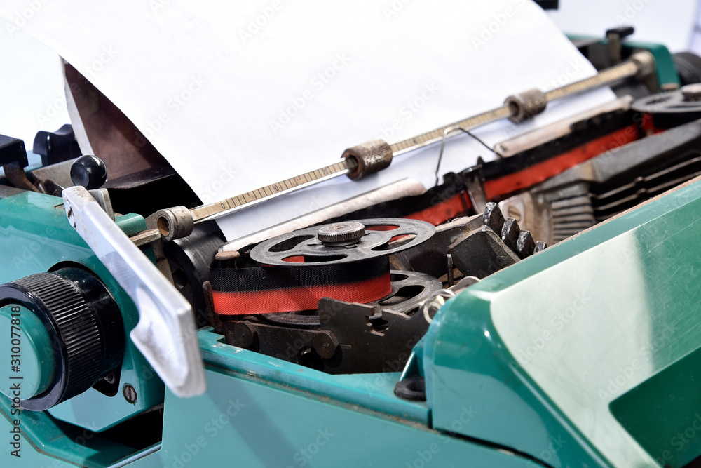 antique green typewriter, analogical typing