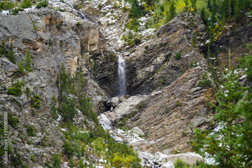 A beautiful waterfall travels down the mountain side in the Teton's Cascade Canyon