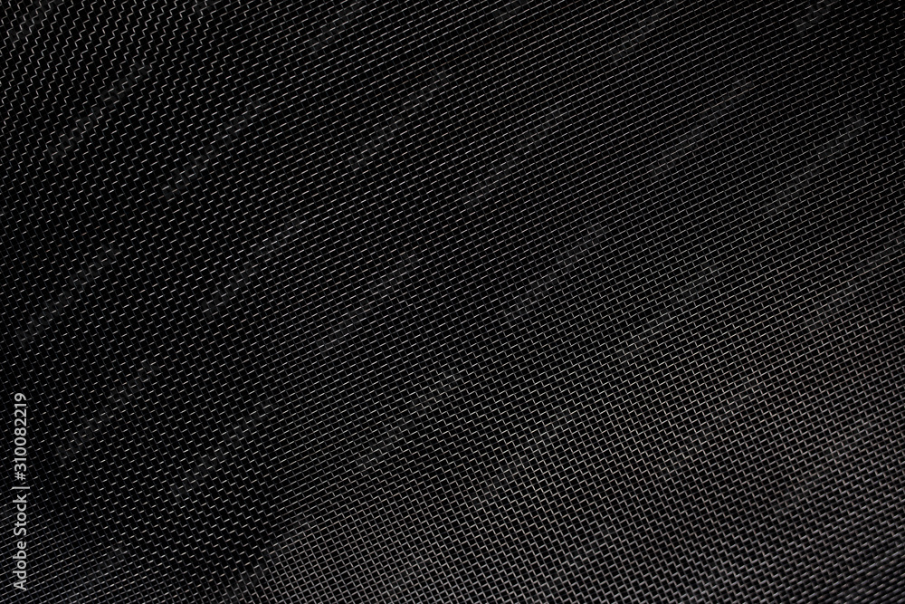 Texture of diagonal and rectangular metal lattice fine weave lattice on black background Texture of diagonal and rectangular metal lattice fine weave lattice on black background