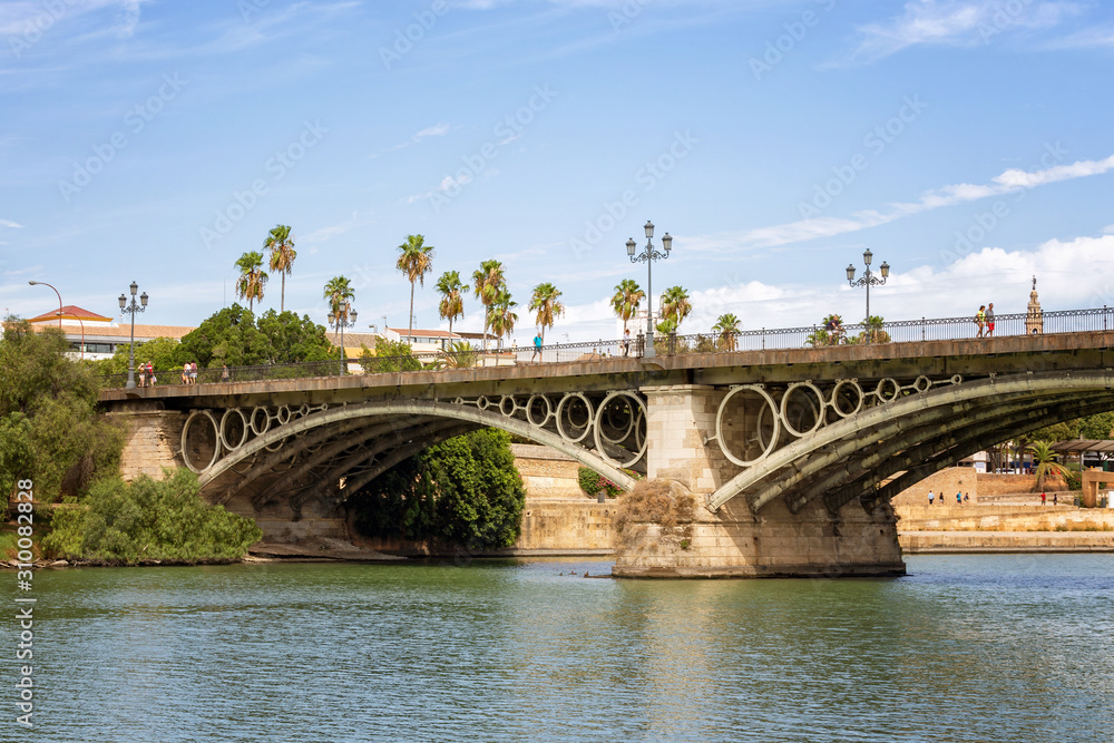 The Puente de Isabel II, Puente de Triana or Triana Bridge, is a metal arch bridge in Seville