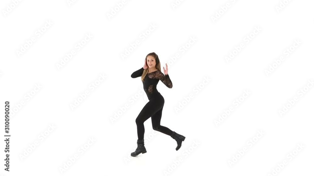 Young female hip-hop dancer dressed in black, performing on a white background Young female hip-hop dancer dressed in black, performing on a white background
