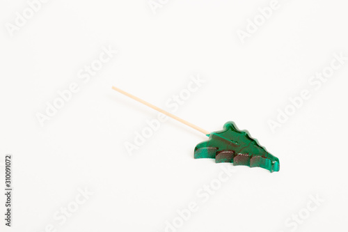 Christmas tree green lollipop on a stick