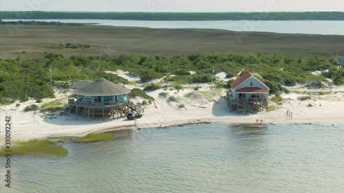 Aerial: Holiday homes on Cedar Island, a small coastal community in the Outer banks, North Carolina, USA. 10 August 2019 photo