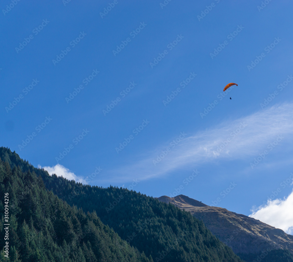 Paragliding under the beautiful sky in Queenstown Paragliding under the beautiful sky in Queenstown