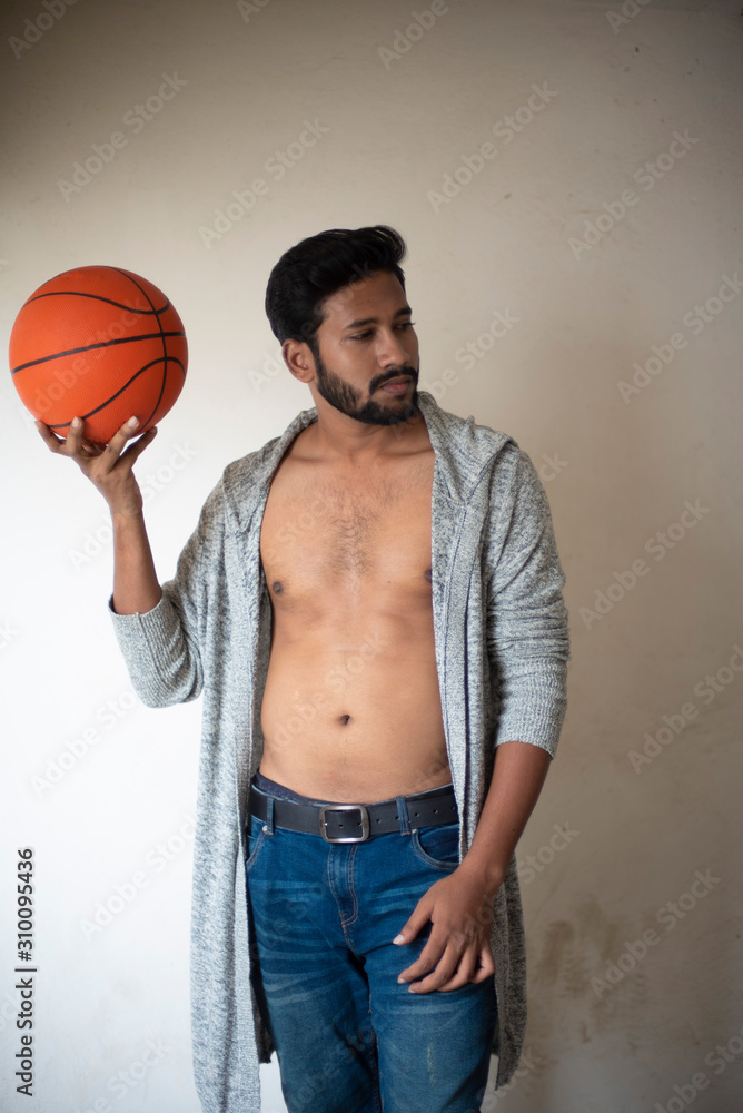 An young tall, dark and handsome Indian Bengali man in a front