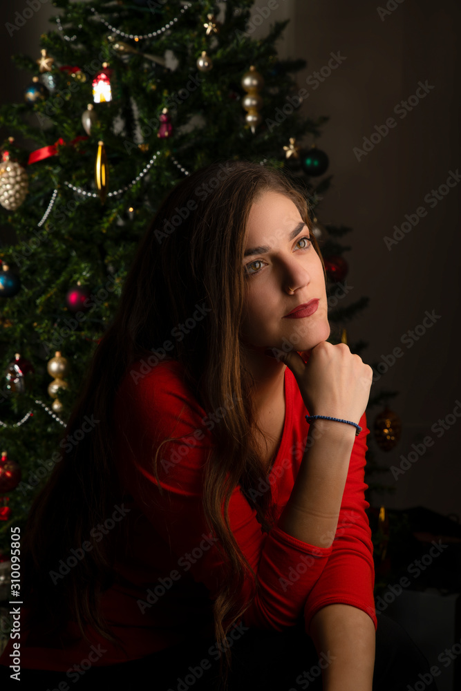 Christmas spirit with a beautiful woman thinking of her love