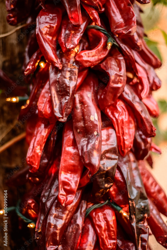 Fototapeta premium Close-up of ristra of drying chile pepper at Santa Fe, New Mexico with lights