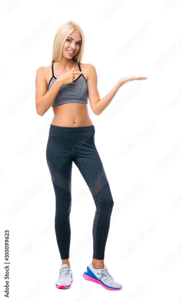 Fitness, sport, training and healthy lifestyle concept - woman in fitness wear showing or giving something, isolated over white background. Individual sports and exercising. Fitness, sport, training and healthy lifestyle concept - woman in fitness wear showing or giving something, isolated over white background. Individual sports and exercising.