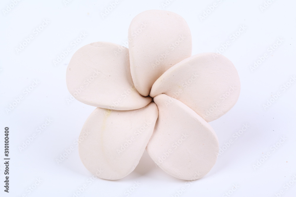 Frangipani flower made of ceramic isolated on white Frangipani flower made of ceramic isolated on white