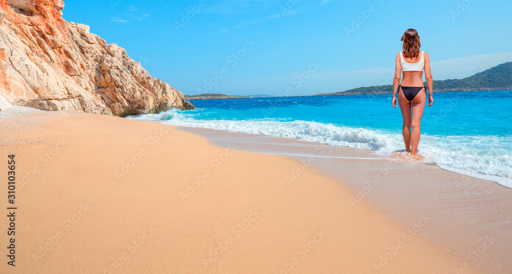 Girl on tropical beach - Beautiful woman in bikini enjoy a swim in the crystal clear water - Kaputas, Antalya