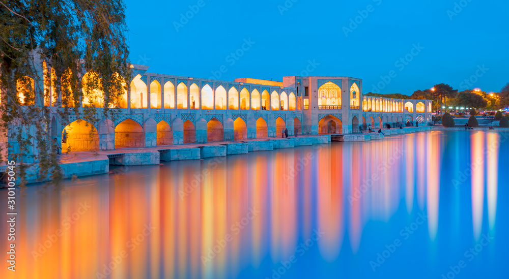 Ancient Khaju Bridge at twilight blue hour - Isfahan, Iran