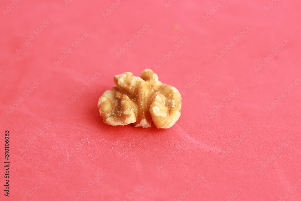 Peeled walnuts in colorful background
