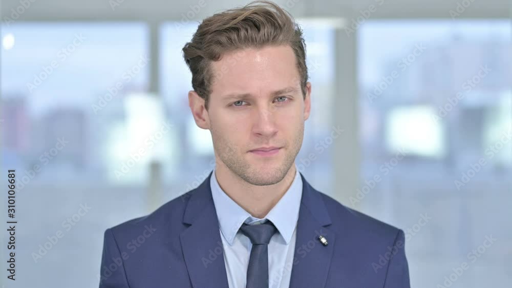 Portrait of Serious Young Businessman saying No by Head Shake Portrait of Serious Young Businessman saying No by Head Shake