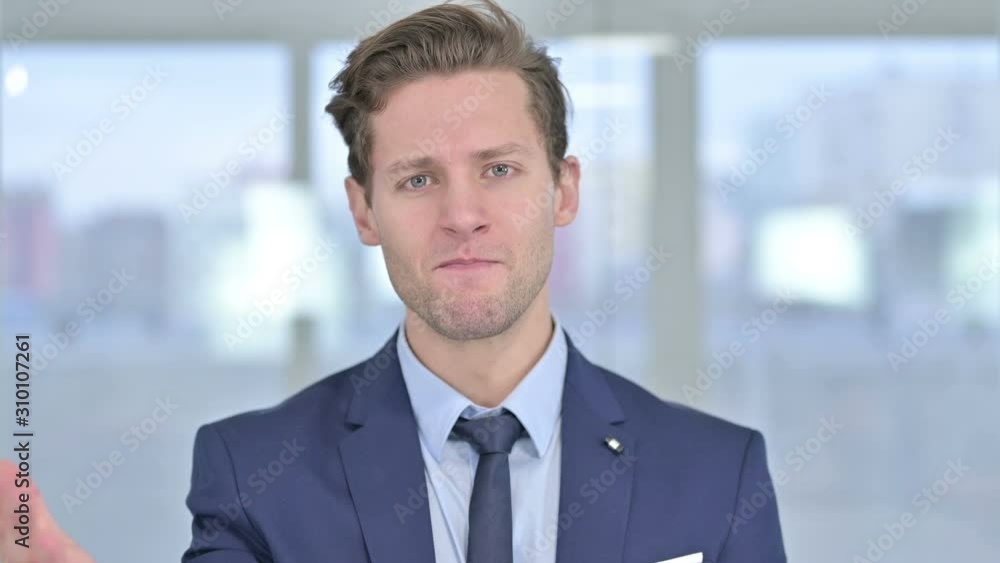 Portrait of Disappointed Young Businessman getting Angry Portrait of Disappointed Young Businessman getting Angry