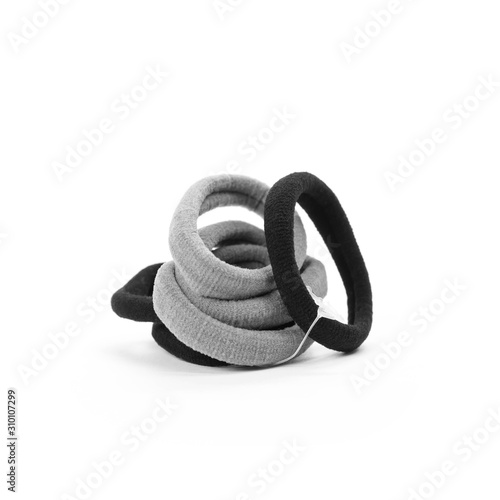 Set of six scrunchies for hair. Gray and black hair bands. Close up. Isolated on white background