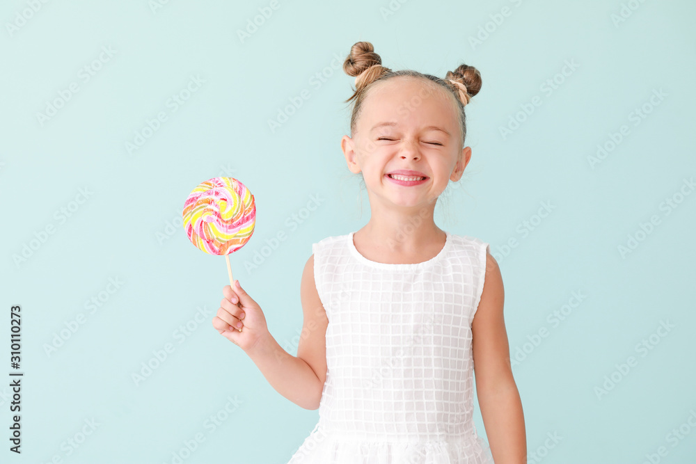 Cute little girl with sweet lollipop on color background Cute little girl with sweet lollipop on color background