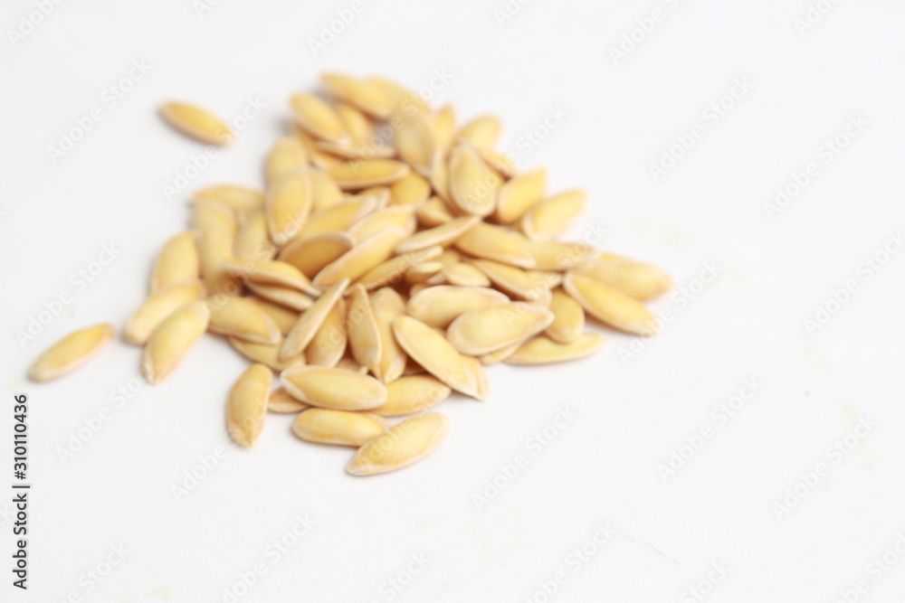 melon seeds on colorful background melon seeds on colorful background