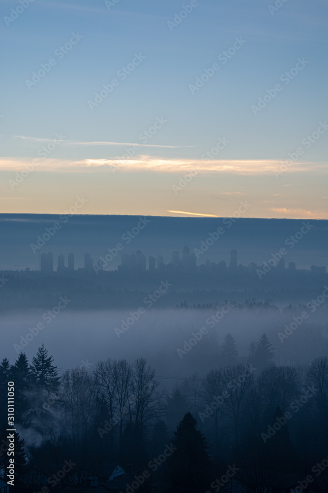 Clear sky above Metrotown covered with thick fog