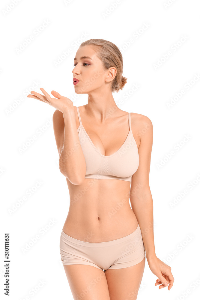 Beautiful young woman in underwear on white background Beautiful young woman in underwear on white background