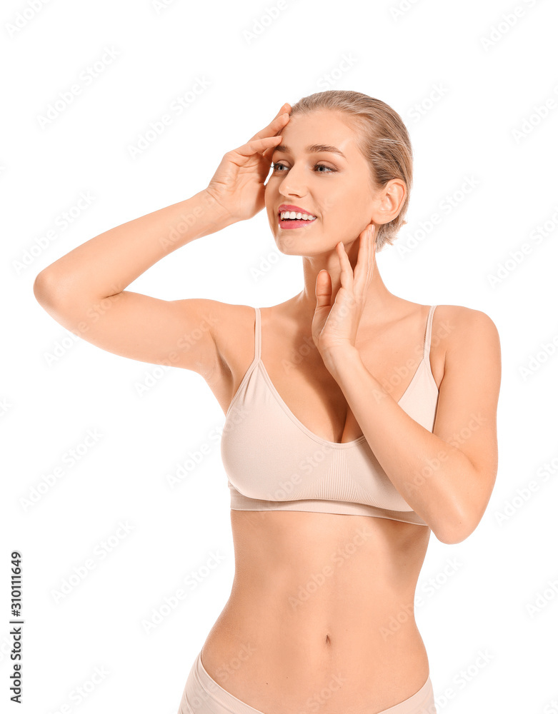 Fototapeta premium Beautiful young woman in underwear on white background