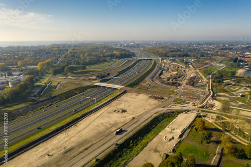 Aerial of A6 highway in Almere with construction work in progress around it