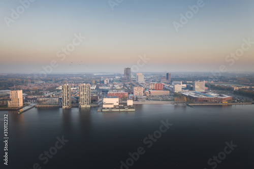 Almere city center in early morning haze/smog. Aerial view. © Pavlo Glazkov