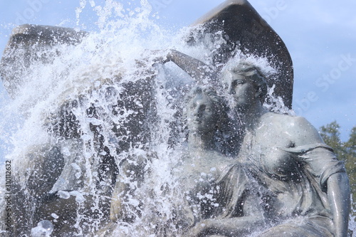 Statues with water pouring on them