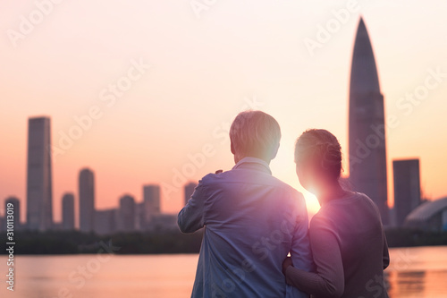 Photography senior asian couple looking sunrise