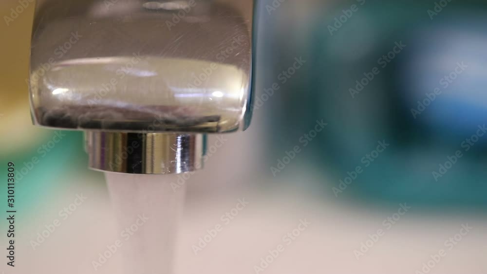 open water from the tap in the bathroom. close-up open water from the tap in the bathroom. close-up