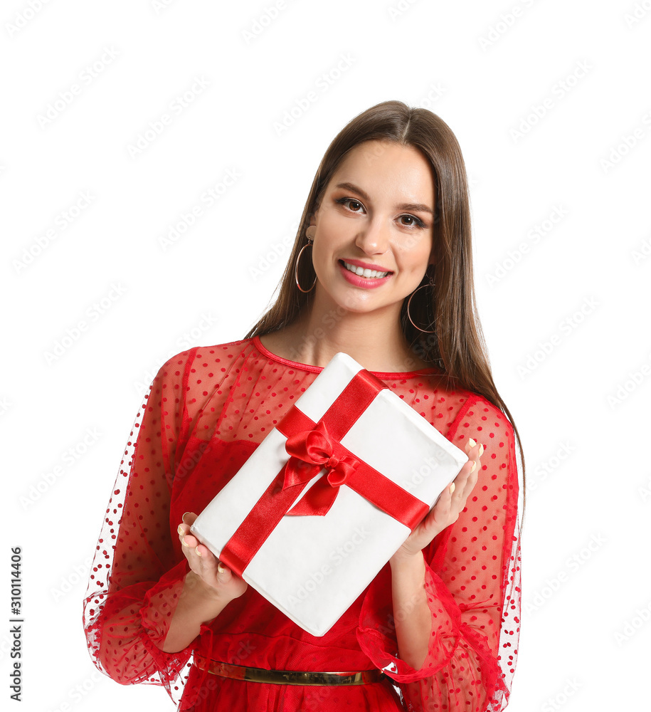 Beautiful young woman with Christmas gift on white background Beautiful young woman with Christmas gift on white background