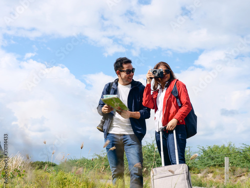 Asian tourists couple have fun with nature background, lifestyle concept.
