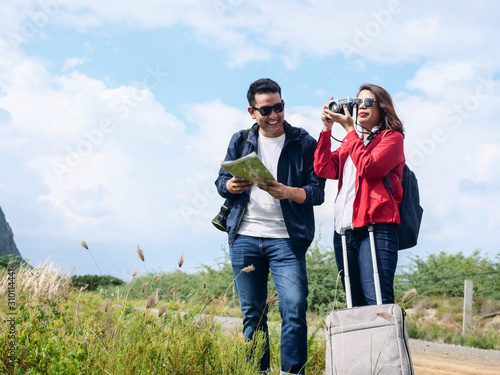 Asian tourists couple have fun with nature background, lifestyle concept.