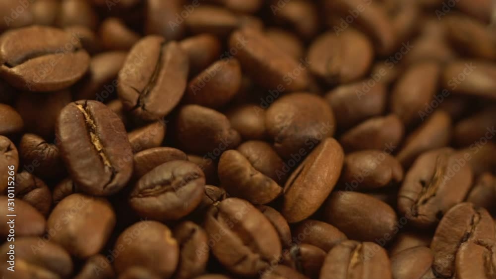 Coffee close up. Roasted coffee beans with. Coffee beans factory mixing. Slow motion. Coffee close up. Roasted coffee beans with. Coffee beans factory mixing. Slow motion.