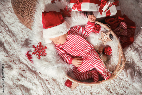 Cute little baby with Santa...