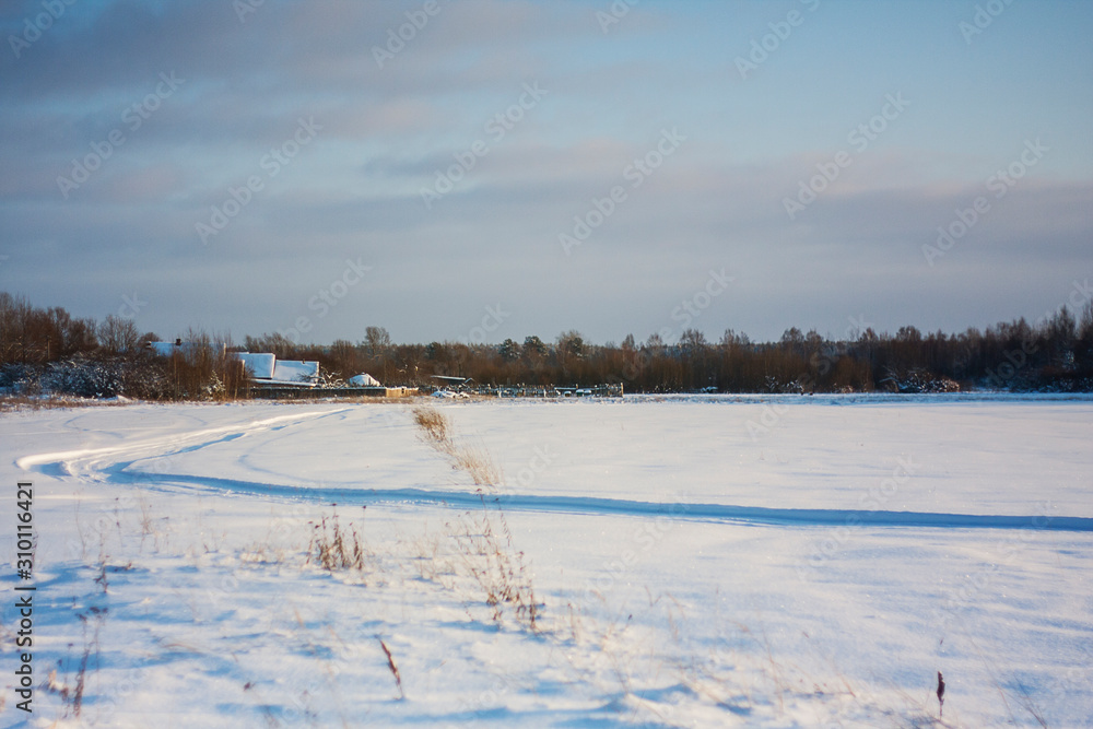 snow covered field in russian village sunny day snow covered field in russian village sunny day