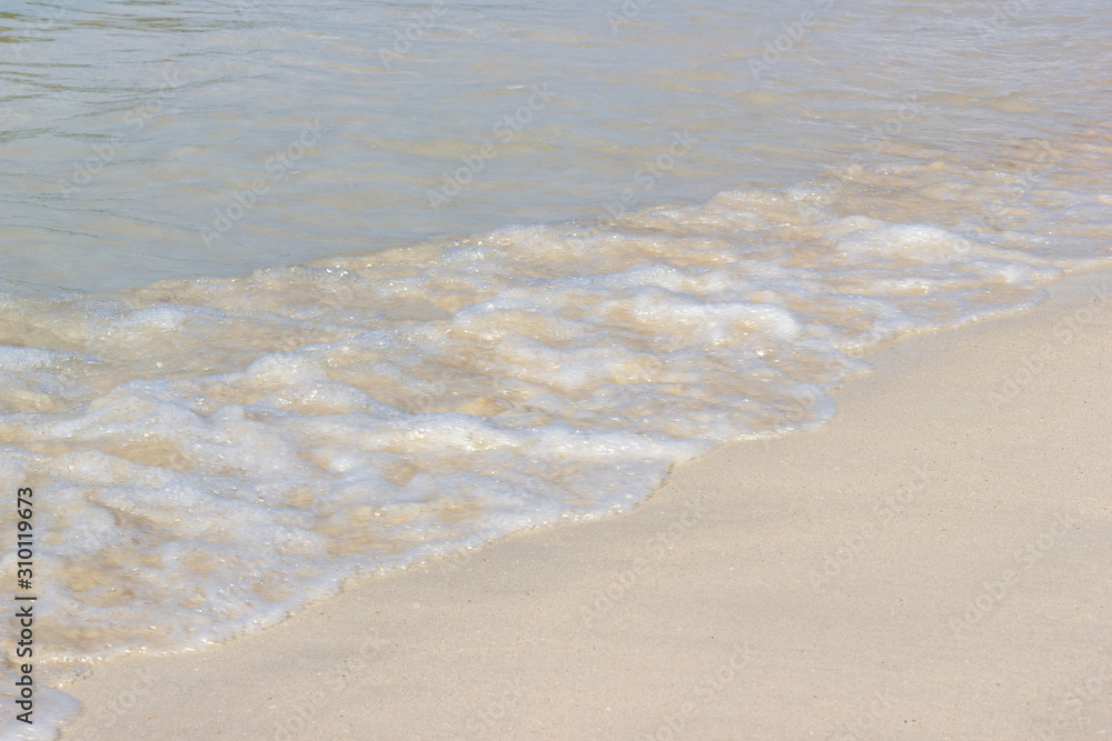 Close up detail of the sea waves washing ashore at the beach Asia Thailand Close up detail of the sea waves washing ashore at the beach Asia Thailand