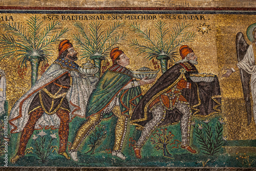  Mosaic of Three Wise Men or Magi wearing trousers and Phrygian caps as a sign of their Oriental origin in Basilica of St Apollinare Nuovo in Ravenna, Italy photo