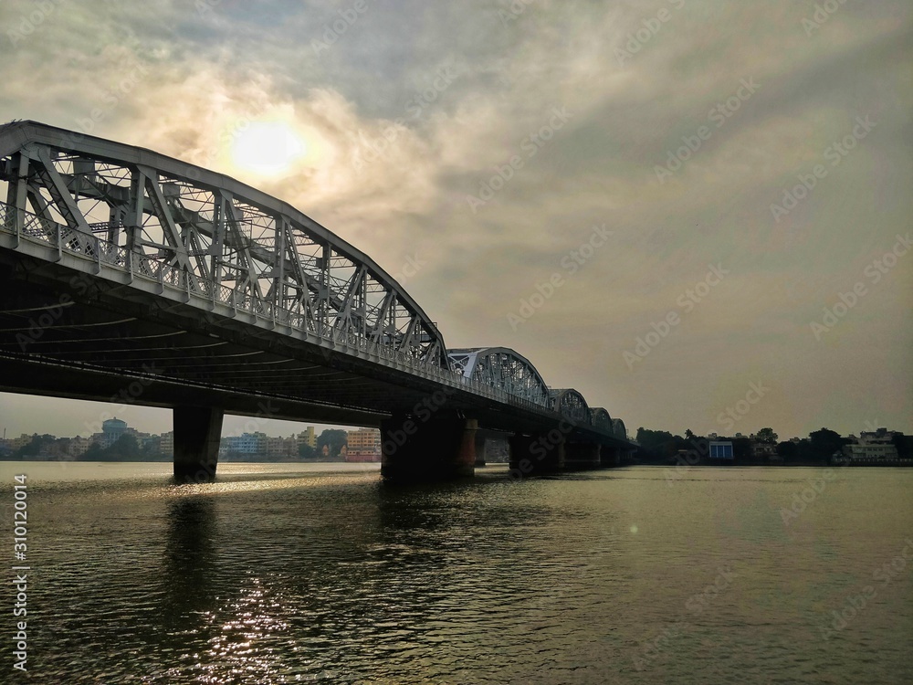 Obraz premium River, bridge and sunset