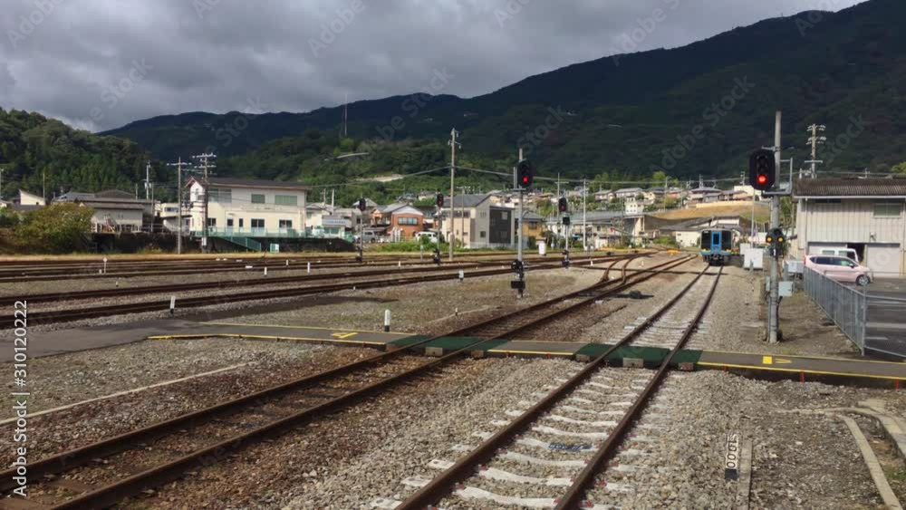 A Commuter Train Arrives At Awa-Ikeda Station, Iya Valley, Japan A Commuter Train Arrives At Awa-Ikeda Station, Iya Valley, Japan
