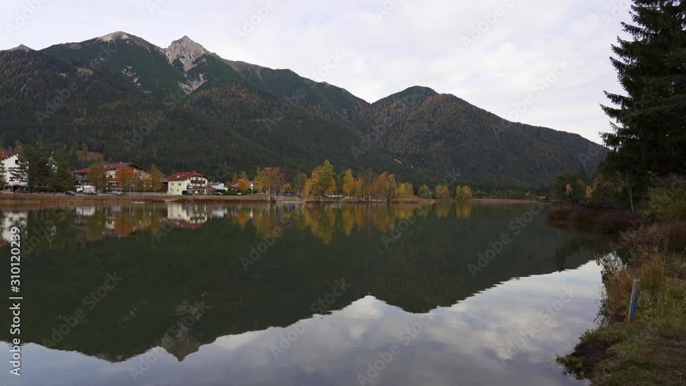 Autumn reflections in Wildsee a lake in the mountains of the alps in Seefeld in Tirol in Austria Autumn reflections in Wildsee a lake in the mountains of the alps in Seefeld in Tirol in Austria